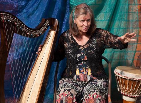 Josie telling a story in Star Anise courtyard, Stroud